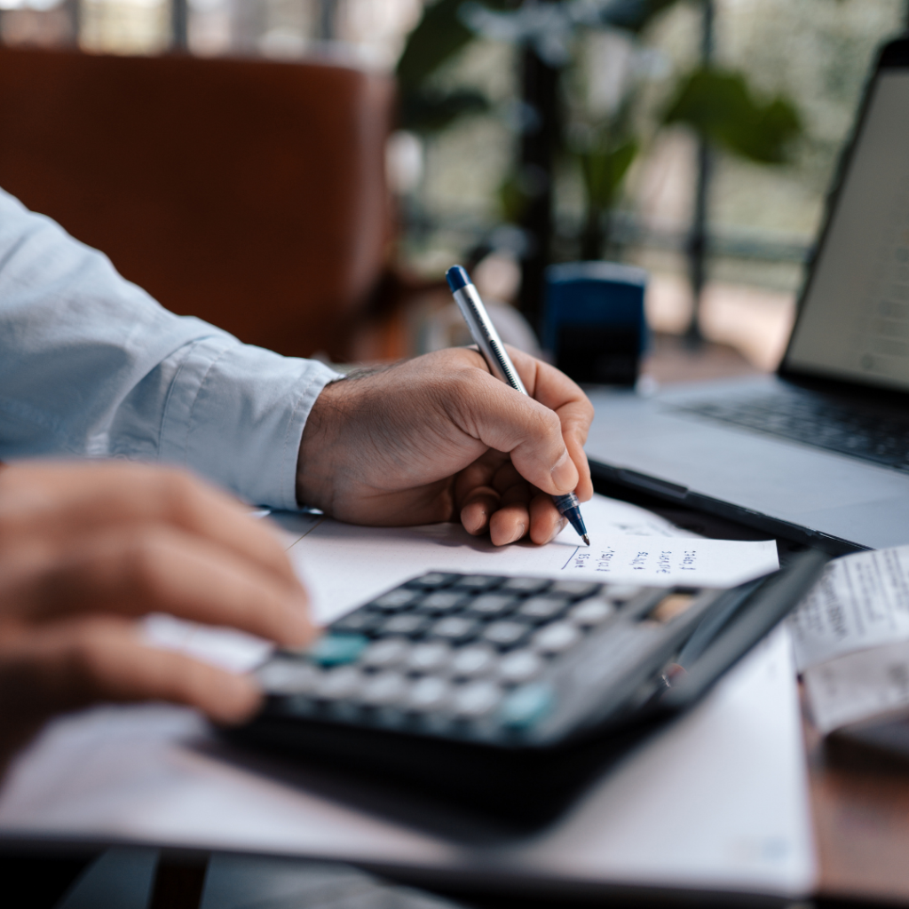 A man with a calculator.